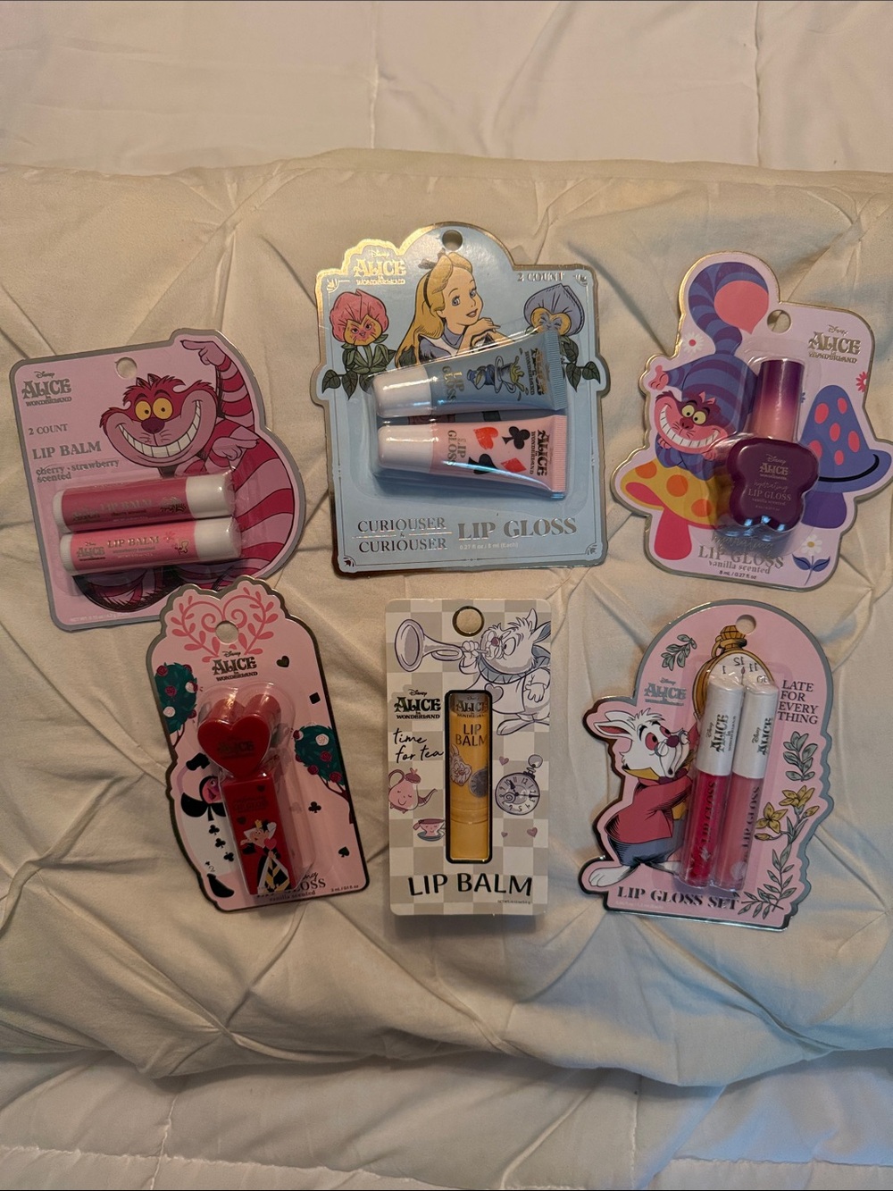 Disney Alice in Wonderland Lip balm/gloss Set — 6 NWT packs.